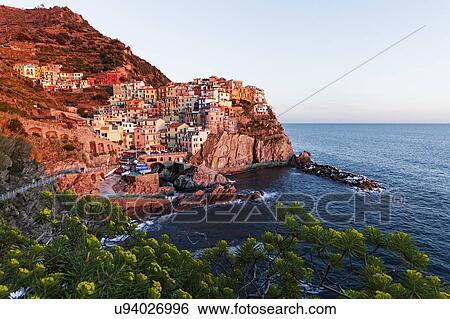 Coastal town at sunset View Large Photo Image Stock Photograph - Coastal town at sunset. Fotosearch