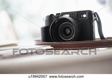 Stock Photo - Digital camera on desk. Fotosearch