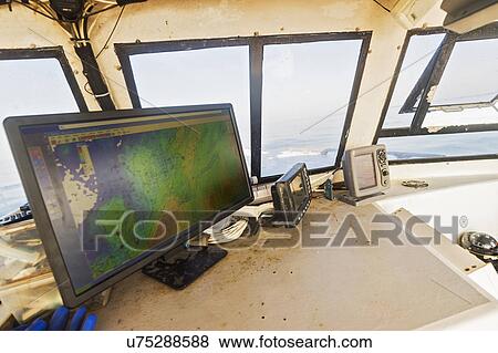 Directions on device screen inside fishing boat View Large Photo Image Stock Photo - Directions on device screen inside fishing boat. Fotosearch