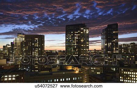 Dramatic sky over city at dusk View Large Photo Image Stock Photo - Dramatic sky over city at dusk. Fotosearch