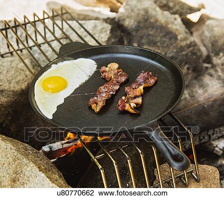 Egg and bacon in skillet View Large Photo Image Stock Image - Egg and bacon in skillet. Fotosearch