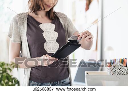 Female fashion designer in her office View Large Photo Image Stock Photo - Female fashion designer in her office. Fotosearch