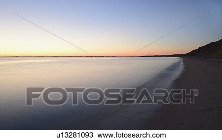 Stock Image - Great Hollow Beach at dusk. Fotosearch