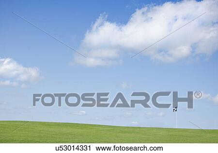 Green field with blue flag View Large Photo Image Stock Image - Green field with blue flag. Fotosearch