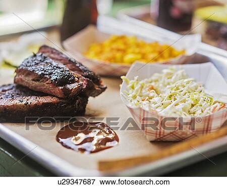 Stock Photo - Grilled meat and salad. Fotosearch