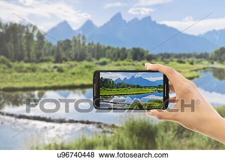 Hand photographing lake View Large Photo Image Stock Photo - Hand photographing lake. Fotosearch