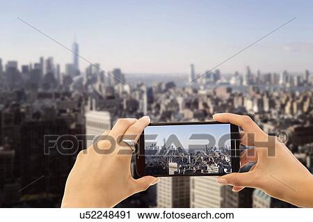 Hands photographing city View Large Photo Image Stock Image - Hands photographing city. Fotosearch