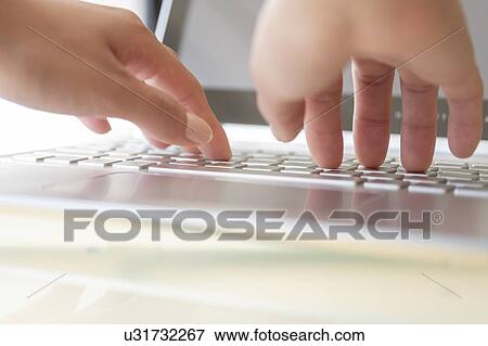 Hands typing on laptop keyboard View Large Photo Image Stock Photo - Hands typing on laptop keyboard. Fotosearch