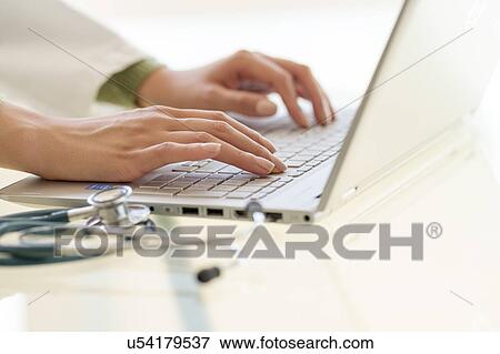 Hands typing on laptop keyboard View Large Photo Image Stock Photo - Hands typing on laptop keyboard. Fotosearch