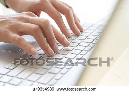 Hands typing on laptop keyboard View Large Photo Image Stock Photo - Hands typing on laptop keyboard. Fotosearch