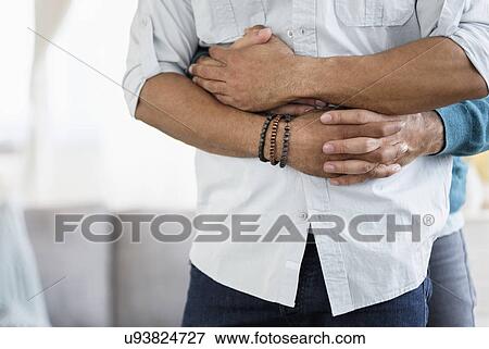Stock Photo - Hugging homosexual couple. Fotosearch