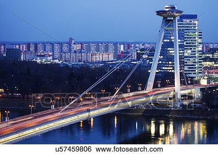 Illuminated bridge over river View Large Photo Image Stock Photograph - Illuminated bridge over river. Fotosearch
