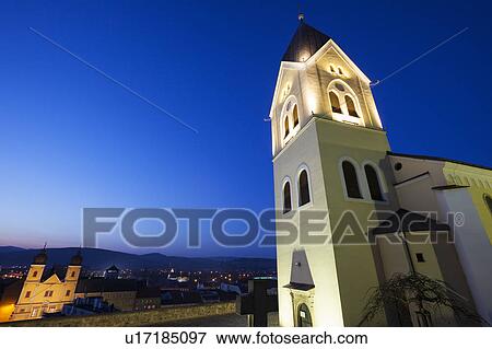 Stock Photo - Illuminated church at dusk. Fotosearch