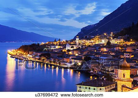 Illuminated cityscape at dusk View Large Photo Image Stock Image - Illuminated cityscape at dusk. Fotosearch