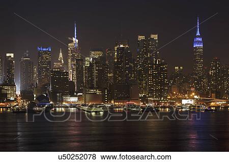Illuminated cityscape at night View Large Photo Image Stock Photo - Illuminated cityscape at night. Fotosearch
