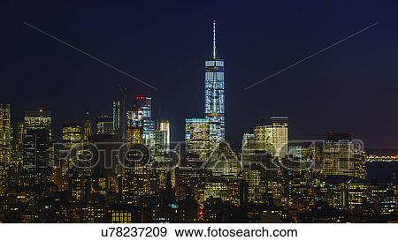 Stock Photo - Illuminated cityscape at night. Fotosearch