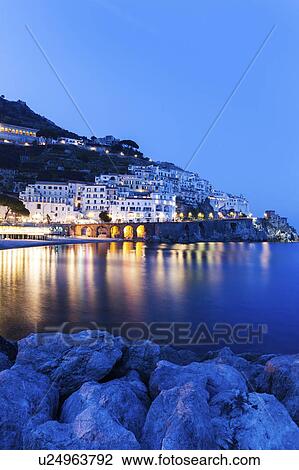 Stock Image - Illuminated town at night. Fotosearch