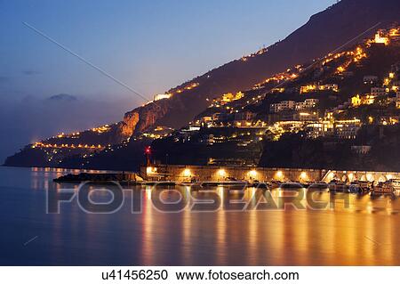 Illuminated town at night View Large Photo Image Stock Image - Illuminated town at night. Fotosearch