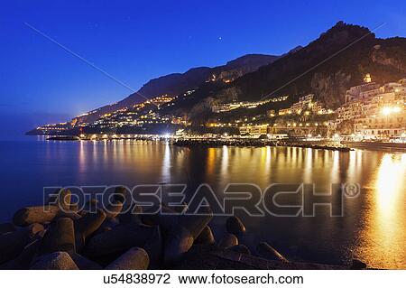 Illuminated town on coastline View Large Photo Image Stock Image - Illuminated town on coastline. Fotosearch