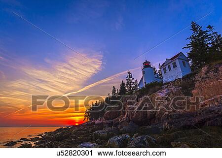 Lighthouse at sunset View Large Photo Image Stock Image - Lighthouse at sunset. Fotosearch