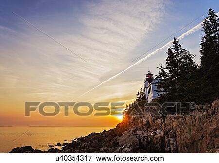 Lighthouse at sunset View Large Photo Image Stock Photo - Lighthouse at sunset. Fotosearch