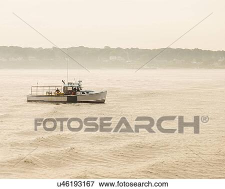 Stock Photo - Lobstermen fishing at sunrise. Fotosearch