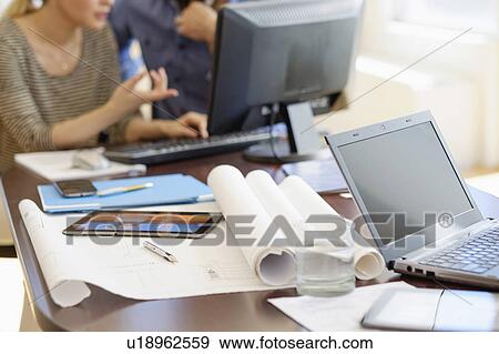 Man and woman working in office View Large Photo Image Stock Photo - Man and woman working in office. Fotosearch