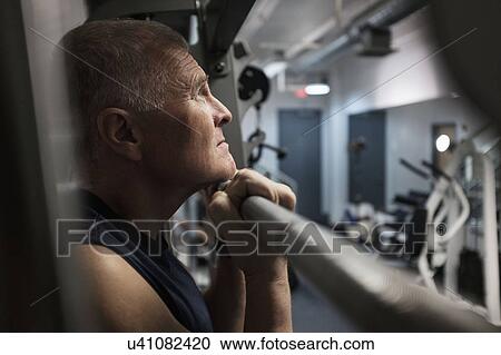 Man in health club doing chin-ups View Large Photo Image Stock Image - Man in health club doing chin-ups. Fotosearch