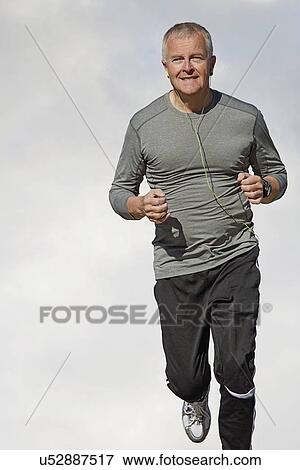 Stock Photo - Man jogging outdoors. Fotosearch