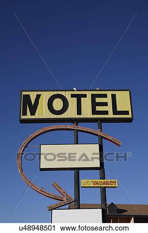 Stock Image - Motel sign against clear sky. Fotosearch