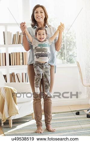 Stock Photo - Mother holding son (2-3). Fotosearch
