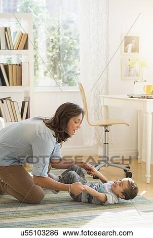Mother playing with son (2-3) View Large Photo Image Stock Photograph - Mother playing with son (2-3). Fotosearch
