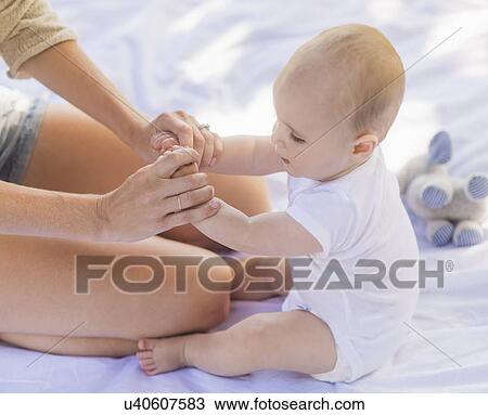 Mother sitting with baby boy (6-11 months) View Large Photo Image Stock Image - Mother sitting with baby boy (6-11 months). Fotosearch