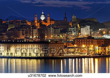 Stock Image - Old town in Genoa across harbor. Fotosearch