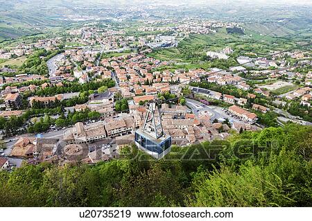 Stock Photo - Overhead cable car with townscape in background. Fotosearch
