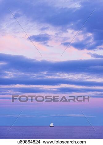 Pastel-colored sunset seascape with sailboat View Large Photo Image Picture - Pastel-colored sunset seascape with sailboat. Fotosearch