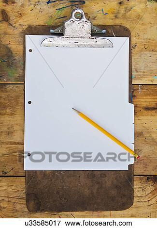 Stock Photo - Pencil and clipboard with blank paper. Fotosearch