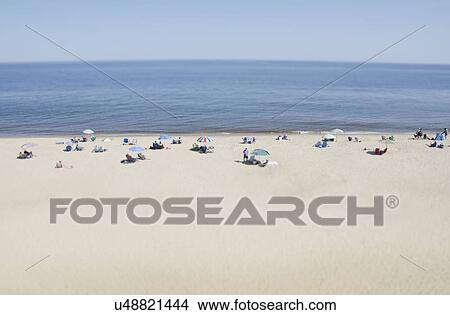 People relaxing on beach View Large Photo Image Picture - People relaxing on beach. Fotosearch