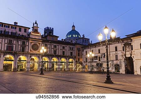 Stock Photograph - Piazza della Loggia at dusk. Fotosearch