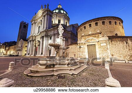 Piazza Paolo VI, Fountain with Duomo Nuovo in background View Large Photo Image Stock Photograph - Piazza Paolo VI, Fountain with Duomo Nuovo in background. Fotosearch