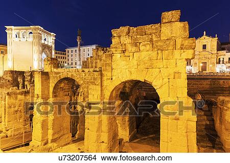 Picture -  Piazza Santo Oronzo and Anfiteatro Romano at dusk. Fotosearch