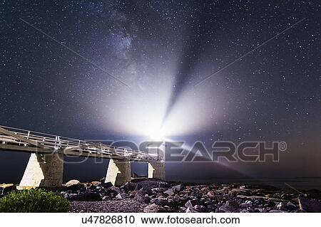 Stock Image - Port Clyde, Marshall Point Lighthouse at night. Fotosearch