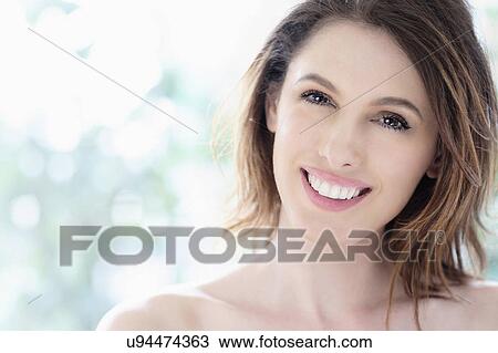 Stock Image - Portrait of beautiful woman with brown hair. Fotosearch