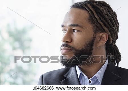 Portrait of businessman wearing suit View Large Photo Image Stock Photograph - Portrait of businessman wearing suit. Fotosearch