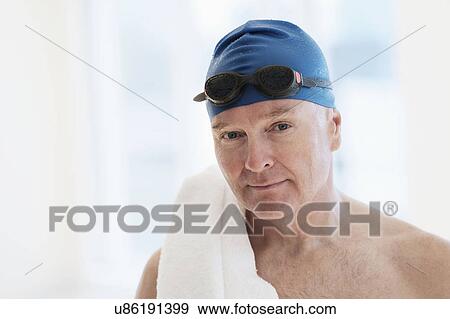 Portrait of man in swimming cap and swimming goggles View Large Photo Image Stock Photo - Portrait of man in swimming cap and swimming goggles. Fotosearch