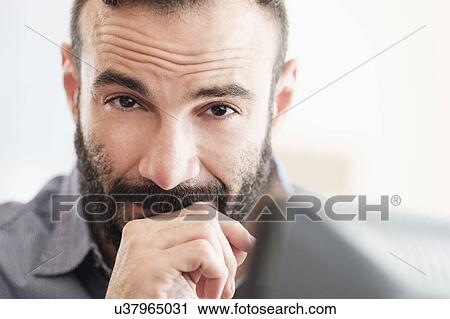 Stock Image - Portrait of mid-adult man. Fotosearch