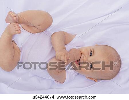 Portrait of smiling baby boy (6-11 months) View Large Photo Image Picture - Portrait of smiling baby boy (6-11 months). Fotosearch