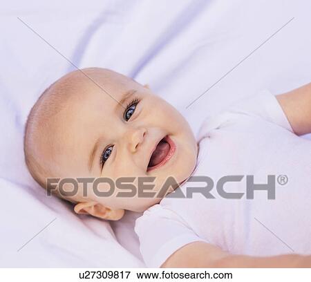 Stock Photo - Portrait of smiling baby boy (6-11 months). Fotosearch
