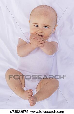 Stock Photography - Portrait of smiling baby boy (6-11 months). Fotosearch