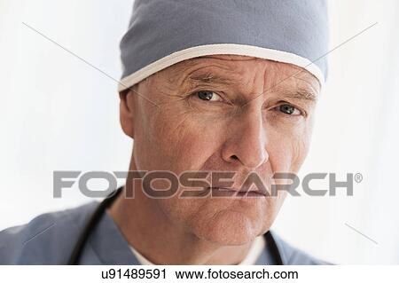 Portrait of surgeon in scrubs and surgical cap View Large Photo Image Stock Image - Portrait of surgeon in scrubs and surgical cap. Fotosearch